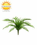 Artificial fern plant with UV protection label on a white background
